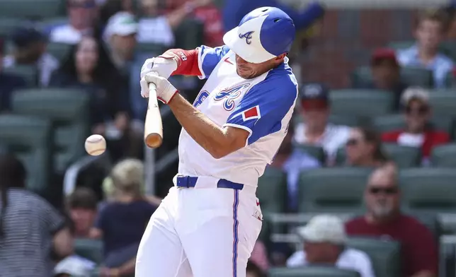 Atlanta Braves' Matt Olson hits a single in the first inning of a baseball game against the Colorado Rockies, Saturday, June 14, 2025, in Atlanta. (AP Photo/Colin Hubbard)