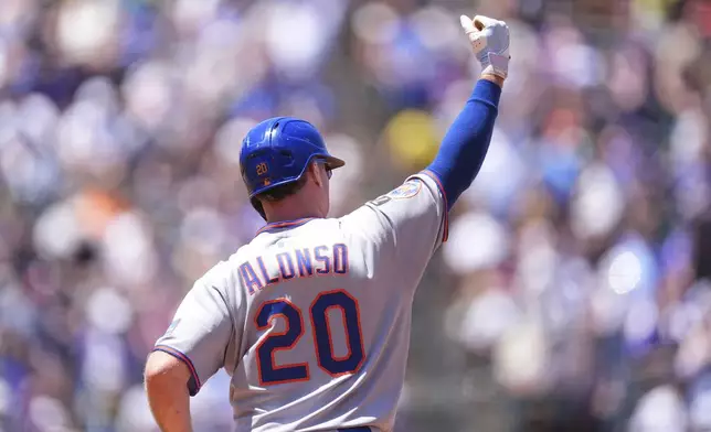New York Mets' Pete Alonso gestures to the bullpen as he circles the bases after hitting a two-run home run off Colorado Rockies starting pitcher Chase Dollander in the third inning of a baseball game Sunday, June 8, 2025, in Denver. (AP Photo/David Zalubowski)