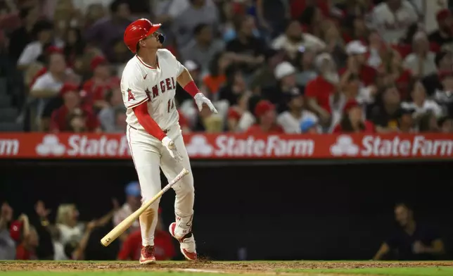 Los Angeles Angels' Kevin Newman watches his three-run home run during the seventh inning of a baseball game against the Washington Nationals, Saturday, June 28, 2025, in Anaheim, Calif. (AP Photo/William Liang)