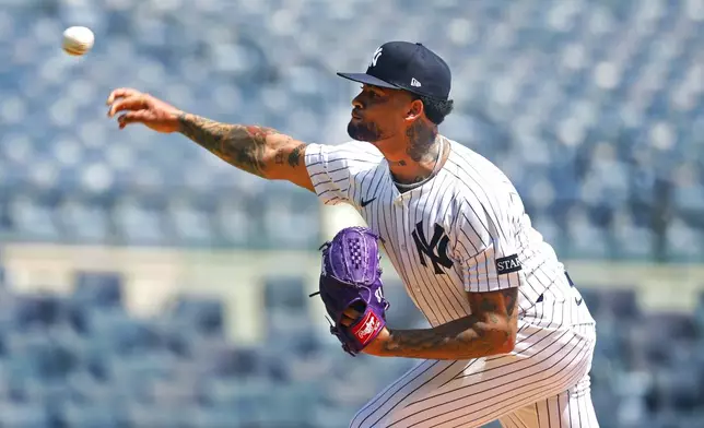 New York Yankees' Luis Gil throws during live batting practice before a baseball game between the New York Yankees and the Baltimore Orioles, Saturday, June 21, 2025, in New York. (AP Photo/Noah K. Murray)