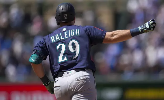 Seattle Mariners' Cal Raleigh runs the bases after hitting a two-run a home run during the seventh inning of a baseball game against the Chicago Cubs, Friday, June 20, 2025, in Chicago. (AP Photo/Erin Hooley)
