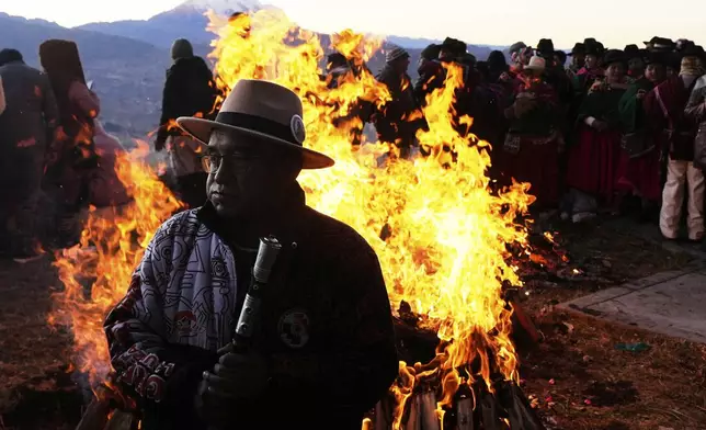 Indigenous people gather to celebrate the Andean New Year 5533 marking the Southern Hemisphere's winter solstice, in El Alto, Bolivia, Saturday, June 21, 2025. (AP Photo/Juan Karita)