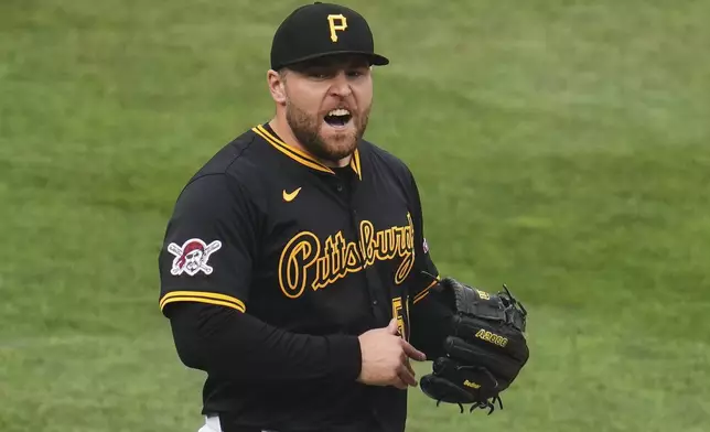 Pittsburgh Pirates pitcher David Bednar celebrates after getting the final out of a baseball game against the Philadelphia Phillies in Pittsburgh, Saturday, June 7, 2025. (AP Photo/Gene J. Puskar)