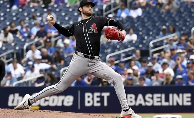 Arizona Diamondbacks relief pitcher Ryne Nelson throws to a Toronto Blue Jays batter in first-inning baseball game action in Toronto, Thursday, June 19, 2025. (Jon Blacker/The Canadian Press via AP)