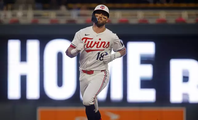 Minnesota Twins' Kody Clemens runs the bases on a solo home run against the Seattle Mariners in the eighth inning of a baseball game Wednesday, June 25, 2025, in Minneapolis. (AP Photo/Bruce Kluckhohn)