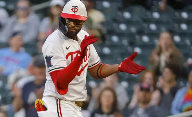 Minnesota Twins' Willi Castro celebrates his RBI single against the Seattle Mariners in the sixth inning of a baseball game Wednesday, June 25, 2025, in Minneapolis. (AP Photo/Bruce Kluckhohn)