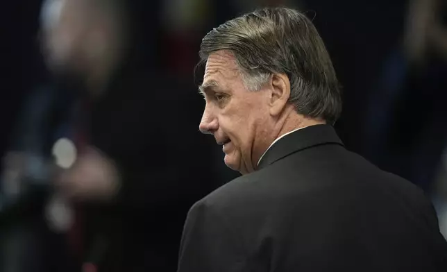 Former Brazilian President Jair Bolsonaro attends his Supreme Court trial along with others charged in an alleged coup plot to keep him in office after his 2022 election defeat, in Brasilia, Brazil, Tuesday, June 10, 2025. (AP Photo/Eraldo Peres)