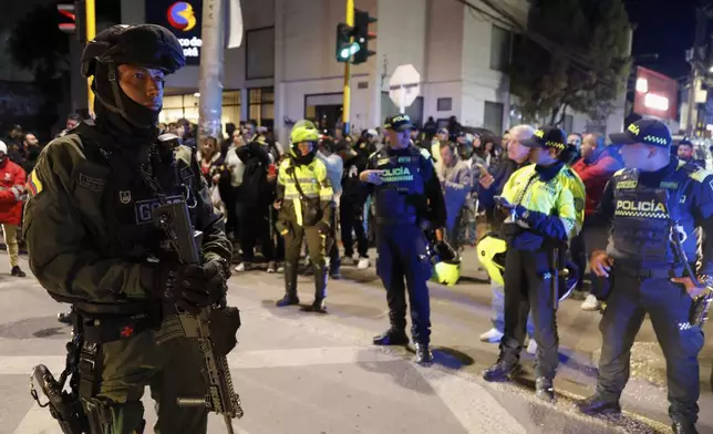 Police stand guard outside the Medicentro hospital where Colombian senator and presidential candidate Miguel Uribe Turbay is being treated after he was shot during a campaign rally in Bogota, Colombia, Saturday, June 7, 2025. (AP Photo/Jhon Wilson Vizcaino)