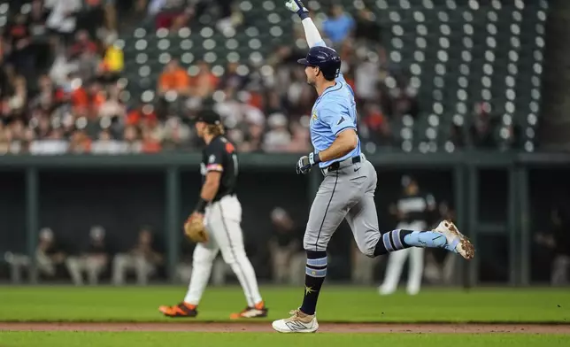 Tampa Bay Rays' Josh Lowe, right, rounds the bases after hitting a home run during the second inning of a baseball game against the Baltimore Orioles, Friday, June 27, 2025, in Baltimore. (AP Photo/Stephanie Scarbrough)