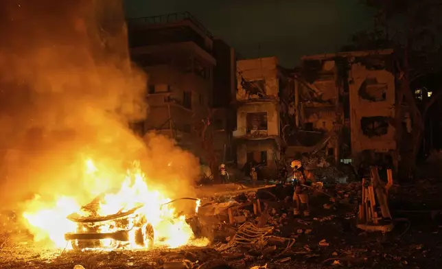 Firefighters work to extinguish a blaze after a missile launched from Iran struck Tel Aviv, Israel, Monday, June 16, 2025. (AP Photo/Baz Ratner)