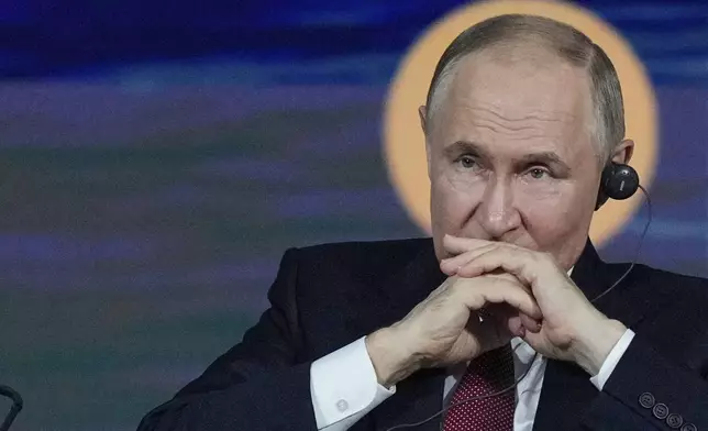 Russian President Vladimir Putin attends a plenary session of the St. Petersburg International Economic Forum in St. Petersburg, Russia, on Friday, June 20, 2025. (AP Photo/Dmitri Lovetsky)