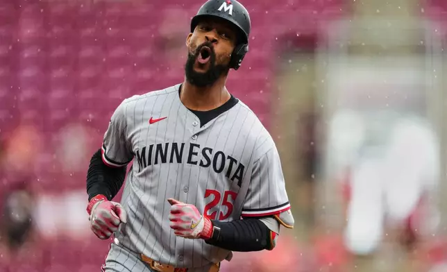 Minnesota Twins' Byron Buxton rounds the bases after hitting a solo home run during the first inning of a baseball game against the Cincinnati Reds, Thursday, June 19, 2025, in Cincinnati. (AP Photo/Grace Bradley)
