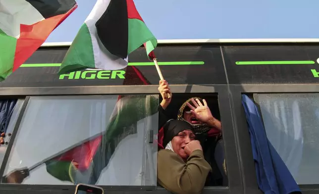 A woman reacts as she rides in a bus, part of a convoy made up of activists, lawyers and medical professionals from North Africa, departing from Tunisia to Gaza to break Israel's blockade on the territory, in Gabes, Tunisia, Monday, June 9, 2025. (AP Photo)