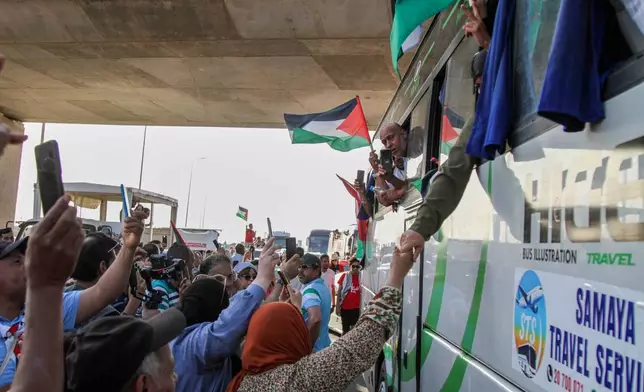 People cheer as a convoy of buses made up of activists, lawyers and medical professionals from North Africa depart from Tunisia to Gaza to break Israel's blockade on the territory, in Gabes, Tunisia, Monday, June 9, 2025. (AP Photo)