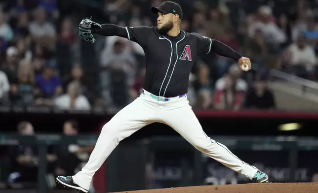 Arizona Diamondbacks starting pitcher Eduardo Rodriguez throws against the Miami Marlins during the first inning of a baseball game Sunday, June 29, 2025, in Phoenix. (AP Photo/Ross D. Franklin)