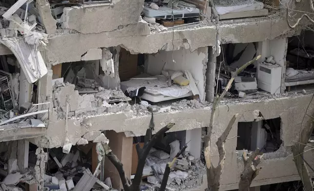 Shattered rooms are seen in an apartment building at the site of a direct missile strike launched from Iran in Tel Aviv, Israel, Sunday, June 22, 2025. (AP Photo/Oded Balilty