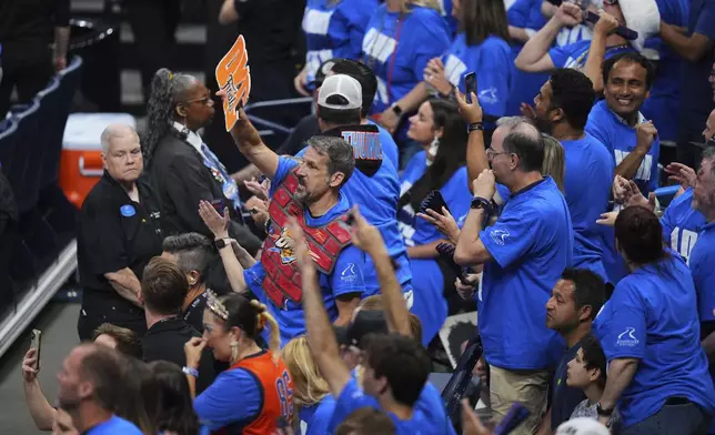 Oklahoma City Thunder fans cheer during the first half of Game 2 of the NBA Finals basketball series against the Indiana Pacers Sunday, June 8, 2025, in Oklahoma City. (AP Photo/Kyle Phillips)