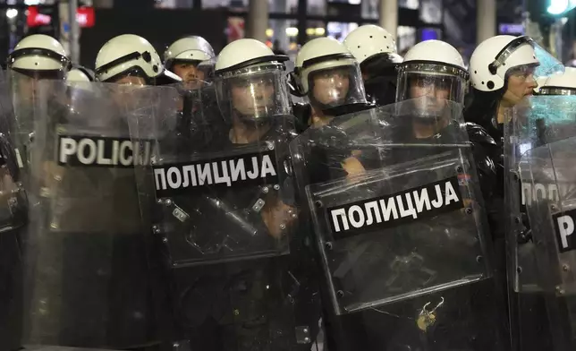 Riot police take positions on a street during a major anti-government rally pressing for an early election after nearly eight months of almost daily anti-corruption demonstrations that have shaken the populist government of President Aleksandar Vucic, in Belgrade, Serbia, Saturday, June 28, 2025. (AP Photo/Marko Drobnjakovic)