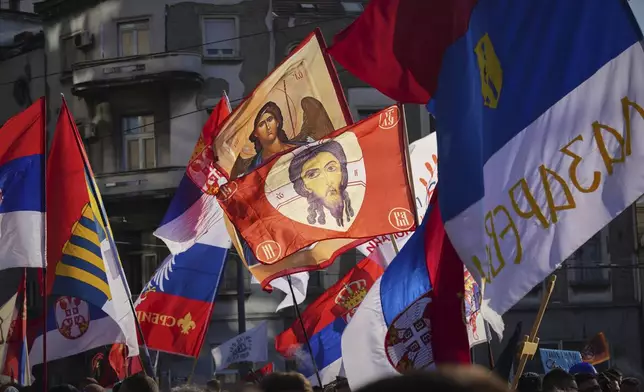 People attend a major anti-government rally to press their demand for an early election after nearly eight months of almost daily anti-corruption demonstrations that have shaken the populist government of President Aleksandar Vucic, in Belgrade, Serbia, Saturday, June 28, 2025. (AP Photo/Darko Vojinovic)