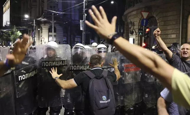 Riot police take positions on a street during a major anti-government rally pressing for an early election after nearly eight months of almost daily anti-corruption demonstrations that have shaken the populist government of President Aleksandar Vucic, in Belgrade, Serbia, Saturday, June 28, 2025. (AP Photo/Marko Drobnjakovic)