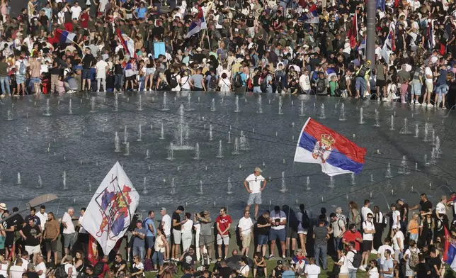 People attend a major anti-government rally to press their demand for an early election after nearly eight months of almost daily anti-corruption demonstrations that have shaken the populist government of President Aleksandar Vucic, in Belgrade, Serbia, Saturday, June 28, 2025. (AP Photo/Marko Drobnjakovic)