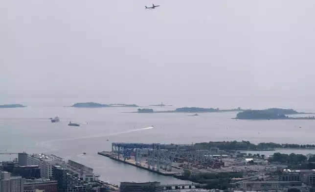 Hazy skies diminish the view of the Boston Harbor Islands, Wednesday, June 4, 2025, in Boston, Mass. (AP Photo/Robert F. Bukaty)