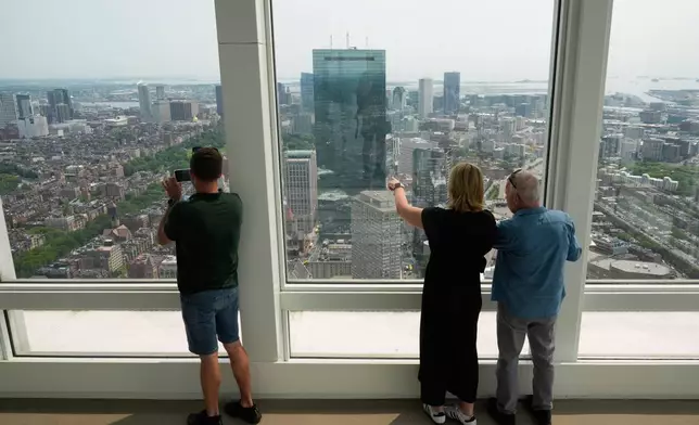 Hazy skies diminish the view from the View Boston observatory, Wednesday, June 4, 2025, in Boston, Mass. (AP Photo/Robert F. Bukaty)