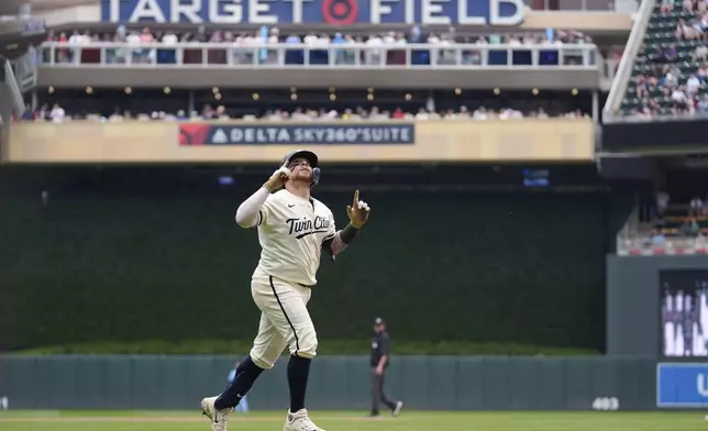 Minnesota Twins' Christian Vazquez (8) runs the bases after hitting a solo home run during the fourth inning of a baseball game against the Toronto Blue Jays, Sunday, June 8, 2025, in Minneapolis. (AP Photo/Abbie Parr)