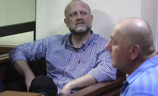 FILE - Opposition leader Zurab Japaridze, center, accused of failing to fulfill the demands of the Georgian parliament's temporary investigative commission probing the activities of the 2003-2012 government and its officials, attends a court hearing in Tbilisi, Georgia, Thursday, May 22, 2025. (Irakli Gedenidze/Pool Photo via AP, File)