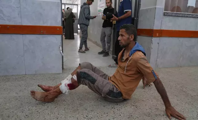 A Palestinian man, who was injured Tuesday night while trying to get access to humanitarian aid, waits to be treated at the al-Shifa Hospital, in Gaza City, Wednesday, June 11, 2025. (AP Photo/Jehad Alshrafi)
