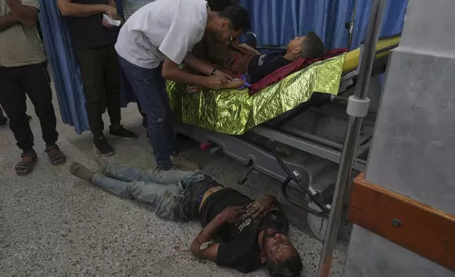 A Palestinian youth, who was injured last night while trying to get access to humanitarian aid, is treated at the al-Shifa Hospital, in Gaza City, Wednesday, June 11, 2025. (AP Photo/Jehad Alshrafi)