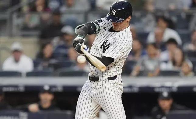 New York Yankees' Cody Bellinger hits an RBI single during the third inning of a baseball game against the Athletics Friday, June 27, 2025, in New York. (AP Photo/Frank Franklin II)