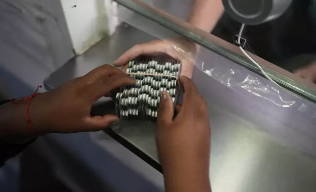 Mari Panoso receives medicine at the Rodolfo Rossi Hospital in La Plata, Argentina, Thursday, May 8, 2025. (AP Photo/Natacha Pisarenko)