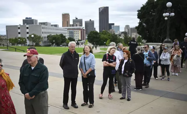 People line up to pay their respect to former Minnesota House Speaker Melissa Hortman, who will lie in state with her husband, Mark, and their golden retriever, Gilbert at the Minnesota Capitol rotunda on Friday, June 17, 2025 in St. Paul, Minn. (Aaron Lavinsky/Star Tribune via AP)