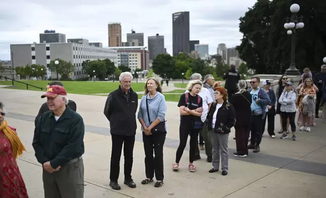 People line up to pay their respect to former Minnesota House Speaker Melissa Hortman, who will lie in state with her husband, Mark, and their golden retriever, Gilbert at the Minnesota Capitol rotunda on Friday, June 17, 2025 in St. Paul, Minn. (Aaron Lavinsky/Star Tribune via AP)