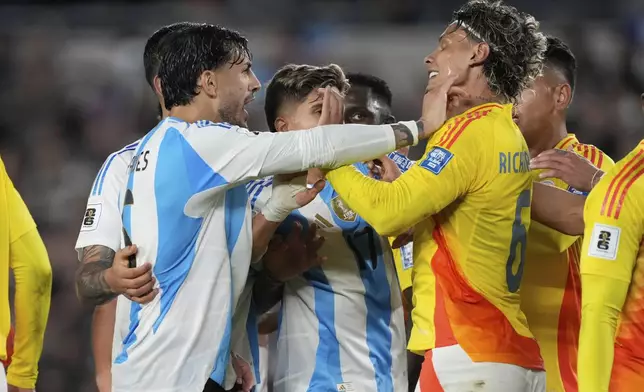 Argentina's Leandro Paredes, left, and Colombia's Richard Rios argue during a qualifying soccer match for the FIFA World Cup 2026 at the Monumental stadium in Buenos Aires, Argentina, Tuesday, June 10, 2025. (AP Photo/Gustavo Garello)