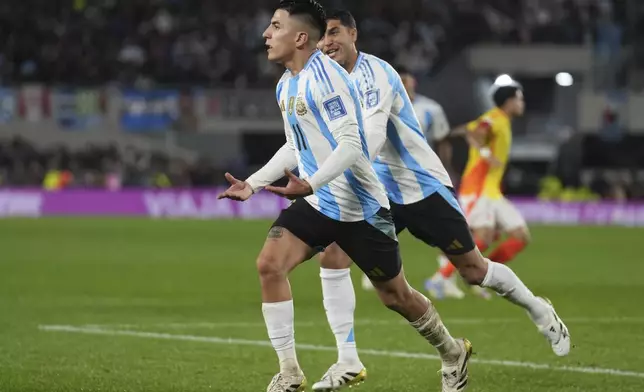 Argentina's Thiago Almada celebrates scoring his side's first goal against Colombia during a qualifying soccer match for the FIFA World Cup 2026 at the Monumental stadium in Buenos Aires, Argentina, Tuesday, June 10, 2025. (AP Photo/Gustavo Garello)
