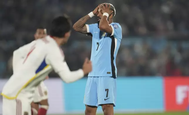 Uruguay's Rodrigo Aguirre, reacts after missing a chance during a qualifying soccer match against Venezuela for the FIFA World Cup 2026 at Centenario Stadium in Montevideo, Uruguay, Tuesday, June 10, 2025. (AP Photo/Matilde Campodonico)