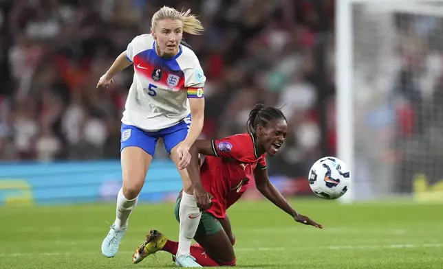 FILE - England's Leah Williamson, left, vies for the ball with Portugal's Diana Silva during the women's Nations League soccer match between England and Portugal at the Wembley Stadium, in London, Friday, May 30, 2025. (AP Photo/Kirsty Wigglesworth, File)