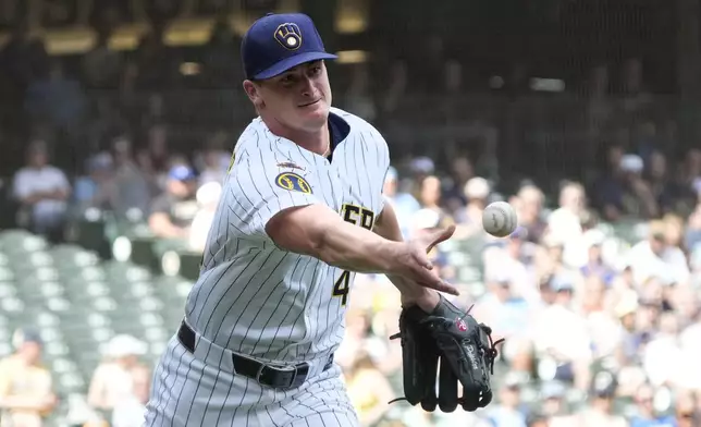 Milwaukee Brewers pitcher Quinn Priester tosses the ball to first base for an out on a ground ball hit by Colorado Rockies' Thairo Estrada during the fourth inning of a baseball game Saturday, June 28, 2025, in Milwaukee. (AP Photo/Kayla Wolf)
