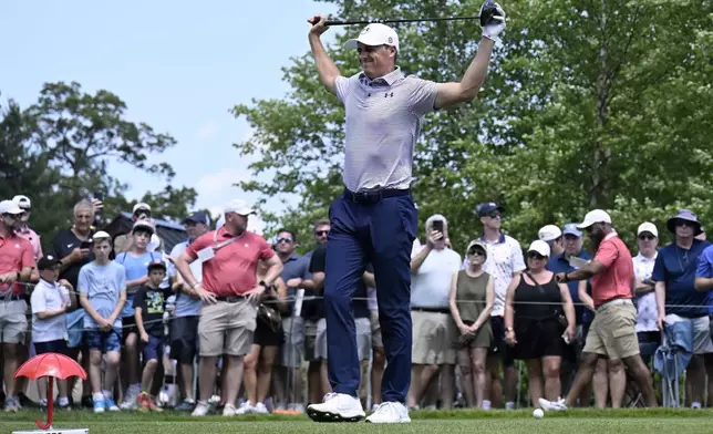 Jordan Spieth stretches at the first hole during the first round of the Travelers Championship golf tournament at TPC River Highlands, Thursday, June 19, 2025, in Cromwell, Conn. (AP Photo/Jessica Hill)