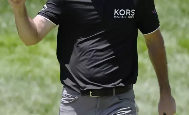 Austin Eckroat reacts after making a birdie on the 18th hole to finish the first round of the Travelers Championship golf tournament at TPC River Highlands, Thursday, June 19, 2025, in Cromwell, Conn. (AP Photo/Jessica Hill)