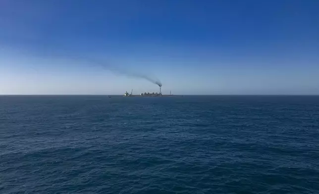 View of the Grand Tortue Ahmeyim (GTA) natural gas extraction platform located 8km from the beach Off the coast of Saint-Louis, Senegal, Thursday, March 13, 2025. (AP Photo/Sylvain Cherkaoui)