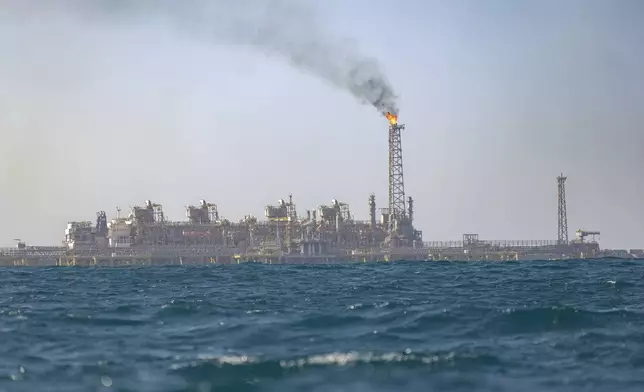 View of the Grand Tortue Ahmeyim (GTA) natural gas extraction platform located 8km from the beach Off the coast of Saint-Louis, Senegal, Thursday, March 13, 2025. (AP Photo/Sylvain Cherkaoui)