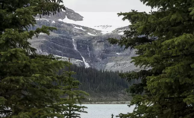 A rock slide, center light grey area, is shown near Bow Glacier Falls north of Lake Louise, Alta., in Banff National Park on Friday, June 20, 2025. (Jeff McIntosh/The Canadian Press via AP)