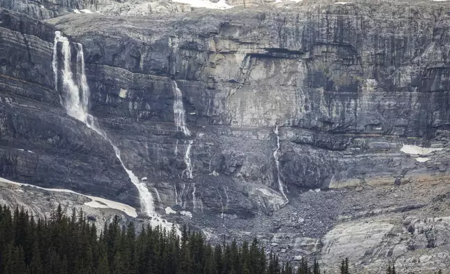 A rock slide, center light grey area, is shown near Bow Glacier Falls north of Lake Louise, Alta., in Banff National Park on Friday, June 20, 2025. (Jeff McIntosh/The Canadian Press via AP)