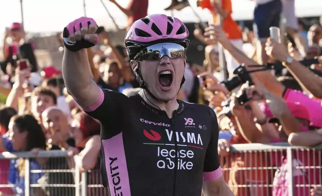 Olav Kooij, from the Netherlands, celebrates after winning the last stage of the Giro d'Italia cycling race, in Rome, Sunday, June 1, 2025. (Fabio Ferrari/LaPresse via AP)