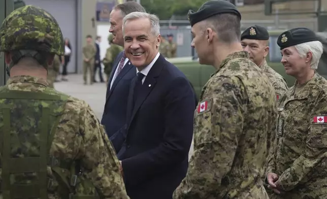 Canada Prime Minister Mark Carney visits Fort York Armoury in Toronto, Canada, before making an announcement on Monday, June 9, 2025. (Chris Young/The Canadian Press via AP)