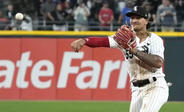 FILE - Chicago White Sox second baseman Jose Rodriguez throws out Texas Rangers' Jonah Heim at first base during the ninth inning of a baseball game in Chicago, Tuesday, June 20, 2023. (AP Photo/Nam Y. Huh, File)