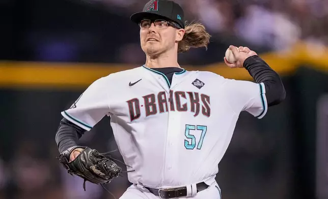 FILE - Arizona Diamondbacks relief pitcher Andrew Saalfrank throws against the Texas Rangers during the ninth inning in Game 3 of the baseball World Series Monday, Oct. 30, 2023, in Phoenix. (AP Photo/Brynn Anderson, FIle)
